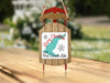 Sled ornament with "Merry Christmas FROM Ross Barnett Lake" text and map graphic.