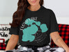 Black t-shirt with graphic of Floyd Lake, Minnesota and compass rose.