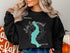 Black sweatshirt featuring "Beautiful Lake Sammamish Washington" map graphic.