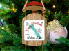 Sled ornament with "Merry Christmas FROM Hudson Lake" and snowflakes.