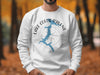 White sweatshirt with Lake Coeur d'Alene map and compass design.