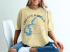 Light yellow t-shirt with blue Lake Cecil M. Harden map and compass graphic.