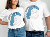 White t-shirts with "Grand Lake Colorado" and a compass rose design.