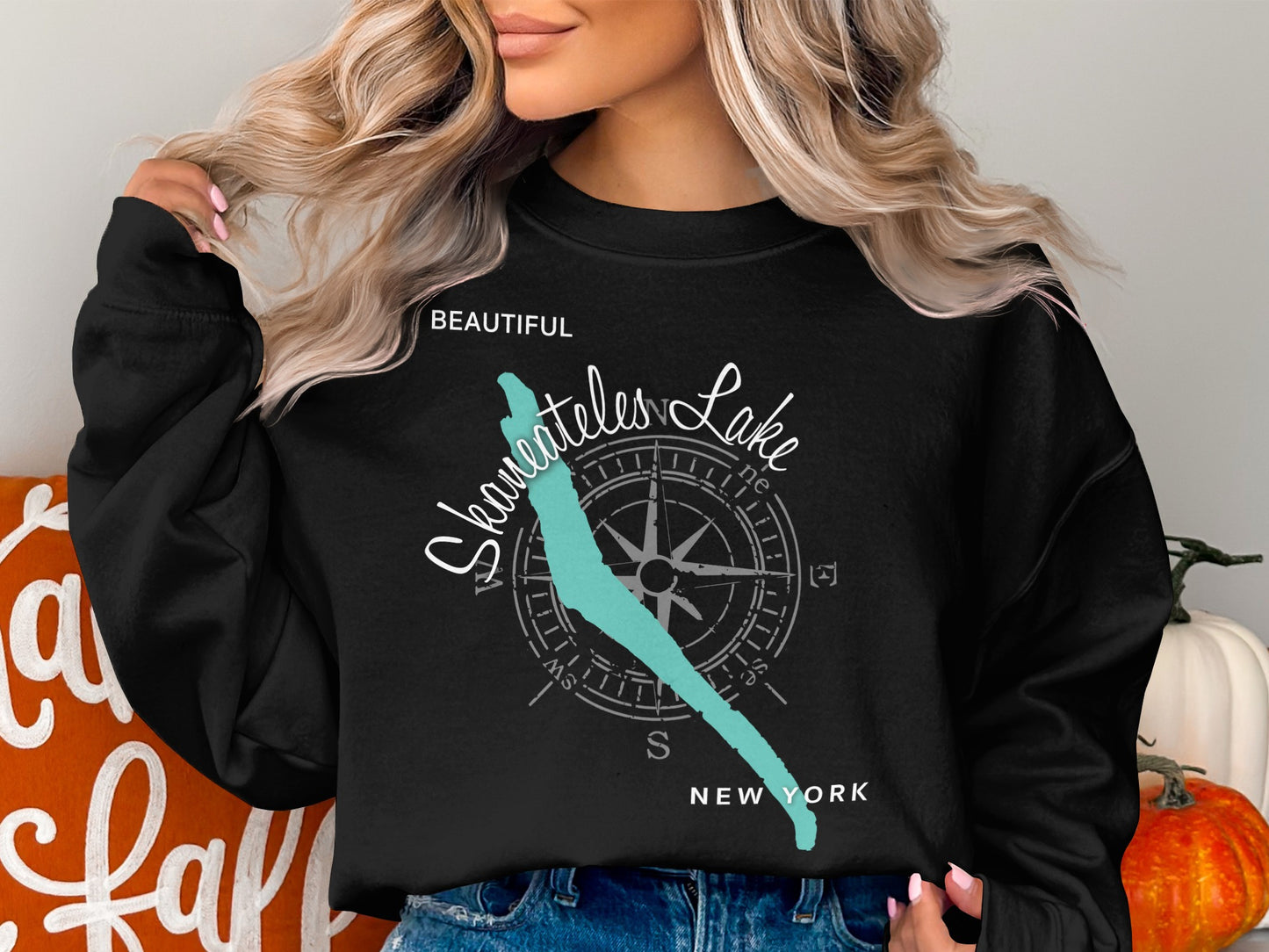 Black sweatshirt with "Beautiful Skaneateles Lake" and compass design.