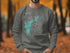 Dark gray sweatshirt with New Hogan Lake map and compass graphic.