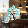 Aqua dragon graphic with "Pomme de Terre Life" text on a clear surface.