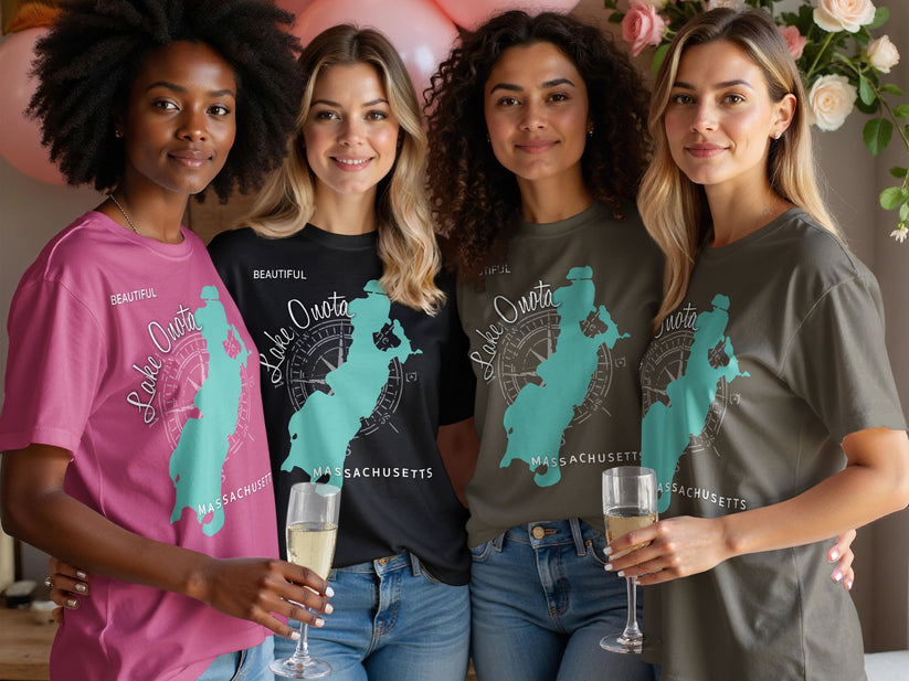 Four women in t-shirts with "Lake Onota Massachusetts" and a compass rose design.