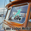 Turquoise lake outline sticker on boat window with "Longview Life" text.