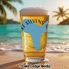 Glass of beer on a beach with "Lake Stevens" in light blue on the glass.