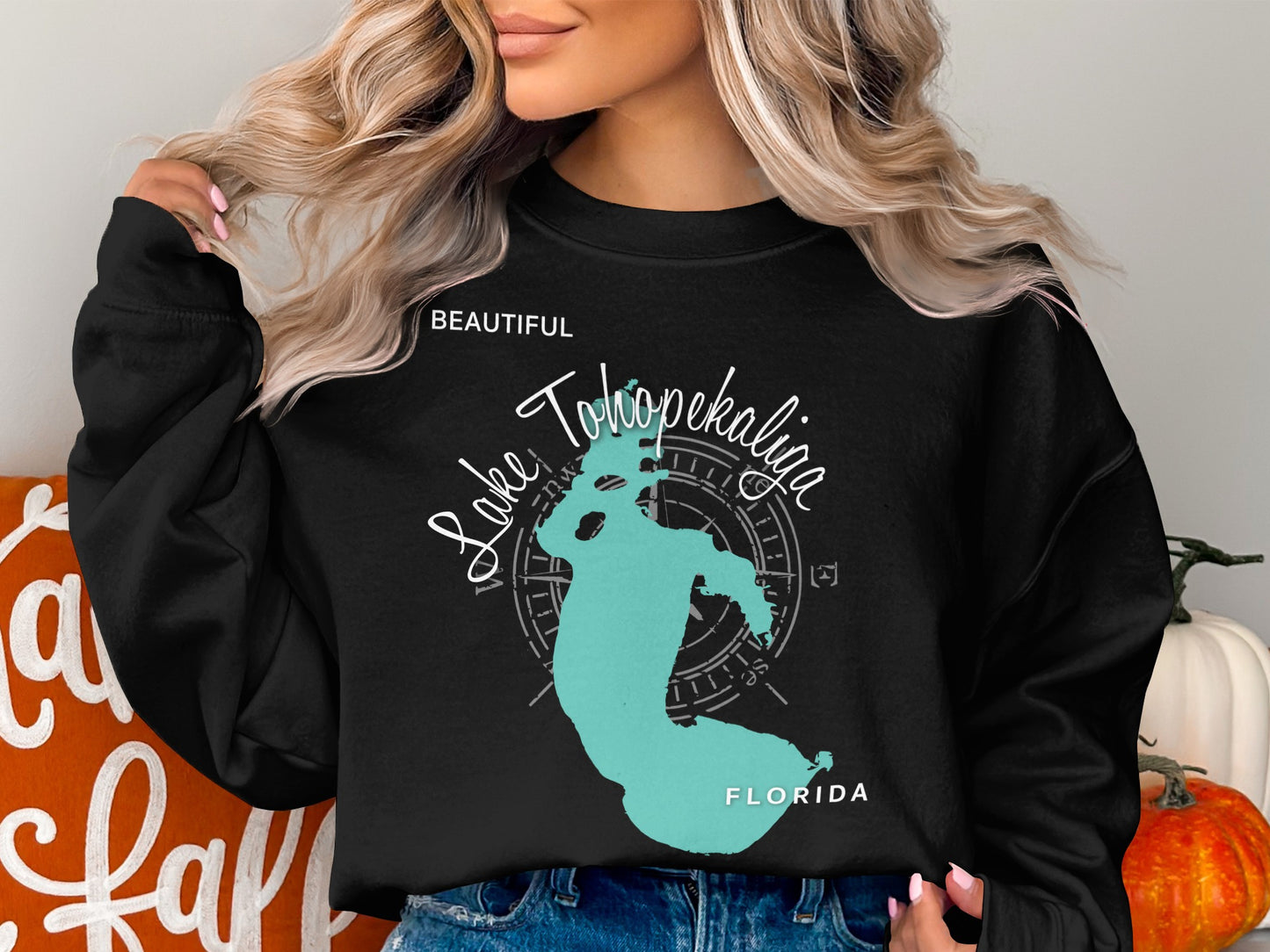 Black sweatshirt with a turquoise outline of Lake Okeechobee, Florida.