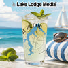 Glass with "Lake Jacomo Missouri" design on beach background.