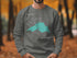 Sweatshirt with a turquoise map of Lake Superior and "Beautiful Lake Superior Michigan" text.