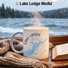 White mug with "Lake Lanier Georgia" and map graphic beside a book.