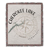 Cherokee Lake Tennessee woven blanket with compass and lake outline design.