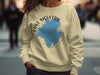 Light yellow sweatshirt with "Lake Moultrie South Carolina" text and blue map graphic.