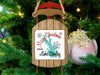 Christmas ornament shaped like a wooden sled with "Merry Christmas from Lake Stanley" text.