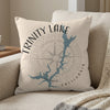 Pillow with Trinity Lake California map and compass design on a sofa.