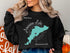 Black sweatshirt with "American Lake Washington" and compass graphic.