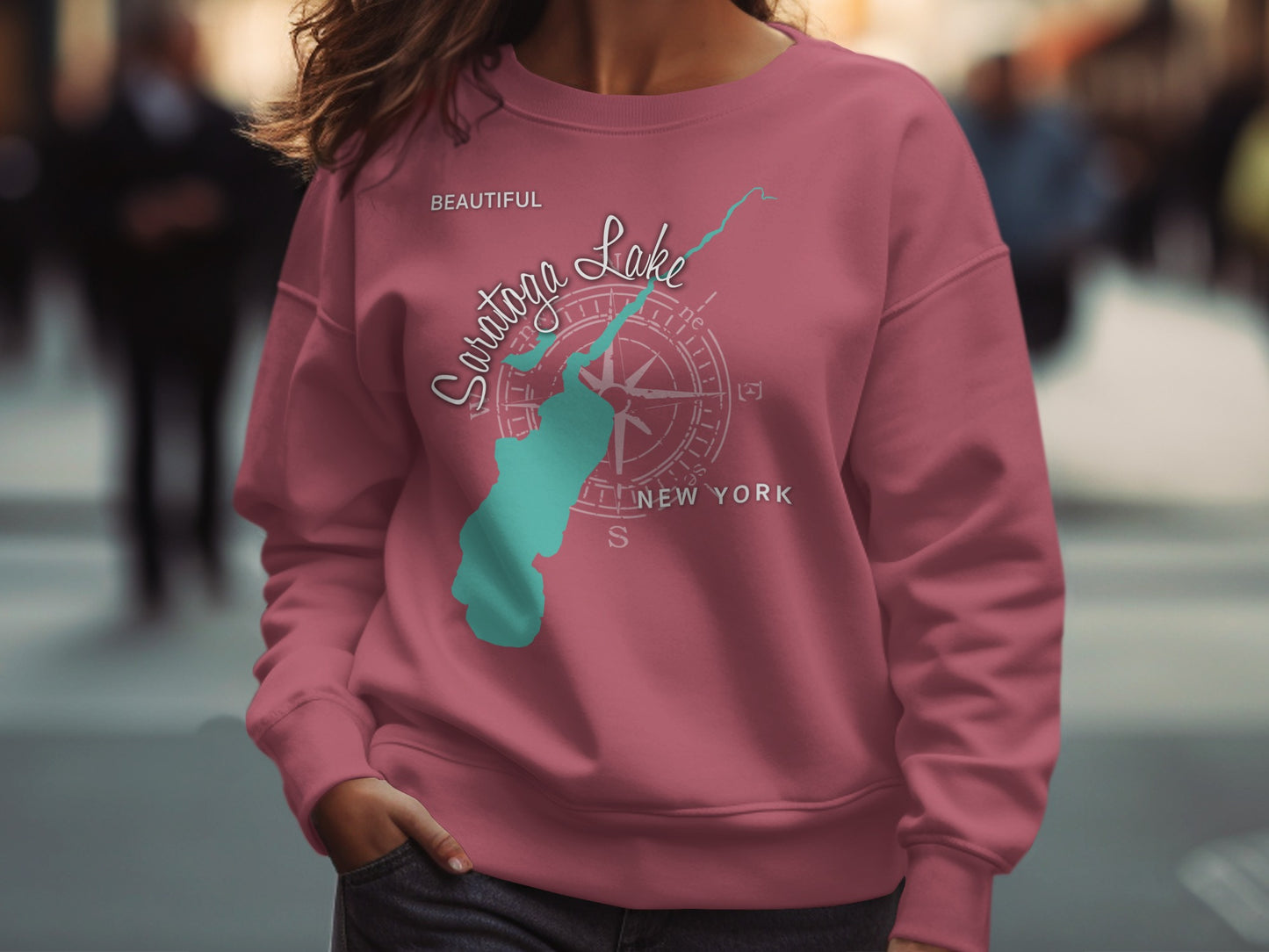 Pink sweatshirt with "Saratoga Lake" and compass rose graphic.