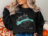 Black sweatshirt with Buckeye Lake Ohio map and compass graphic.