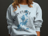 Crewneck sweatshirt with blue map of Chain o'Lakes Illinois and compass graphic.