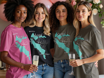 Four women in t-shirts with Lake Merced, California compass design.
