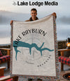 Man holding a blanket with Lake Rayburn, Arkansas design and compass graphic.