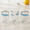 Three clear glasses feature "North Channel Michigan" text with a blue map and compass graphic.