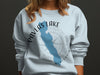 Light blue sweatshirt with Pavlas Lake map, compass, and Wisconsin text.