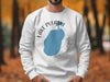 White sweatshirt with Lake Pulaski Minnesota map and compass design.