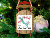 Sled-shaped ornament, "Merry Christmas from Lake San Pablo" text, on a Christmas tree.