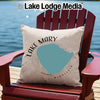 Light beige pillow with "Lake Mary Minnesota" and lake silhouette on a chair.