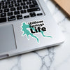 Turquoise sticker with "Willow Springs Life" text on a laptop.