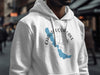 White hoodie with Chautauqua Lake, compass, and New York graphic.