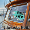 Round Valley Life logo on a boat window with Lake Lodge Media text.