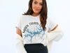 White t-shirt with Mark Twain Lake Missouri map and compass graphic.