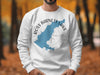 White sweatshirt with blue outline of Ross Barnett Lake and compass design.