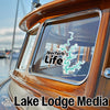 Norfolk Life sticker on a boat window with "Lake Lodge Media" text.