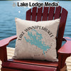 Light-colored pillow with a teal Lake Winnipesaukee map and compass design.