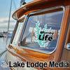 Teal Murray Life sticker on a boat window; Lake Lodge Media text below.