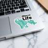 Turquoise sticker with "Marco Life" text and a detailed outline of a person.