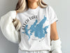 White t-shirt with blue map of Leech Lake, Minnesota and compass graphic.