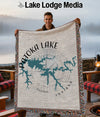 Man holds Patoka Lake Indiana map blanket with compass rose design.