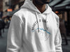 White hoodie featuring "Wheeler Lake Alabama" on a compass graphic with a blue river outline.