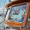Sticker on boat window: "Possum Kingdom Life" with lake silhouette. Lake Lodge Media logo.