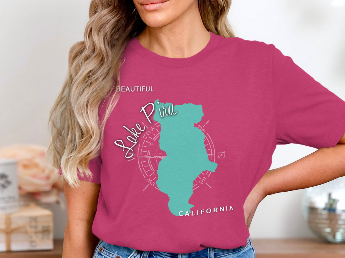 Pink t-shirt with teal Lake Piru map and compass rose design.