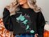 Black sweatshirt with "Madison Lakes Wisconsin" and compass rose map design.
