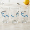 Three clear glasses with Alder Lake map and compass design.