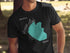Black t-shirt with teal Hauser Lake map and compass graphic.