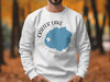 White sweatshirt with Crater Lake Oregon map and compass graphic on chest.